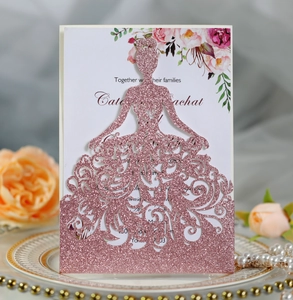 Detail of laser-cut glitter girl silhouette on an elegant floral wedding invitation card