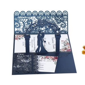 Intricate laser-cut navy lace wedding invitation featuring a 3D popup bride and groom