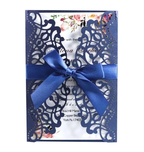 Navy blue laser cut wedding invitation with ribbon and floral printed card insert