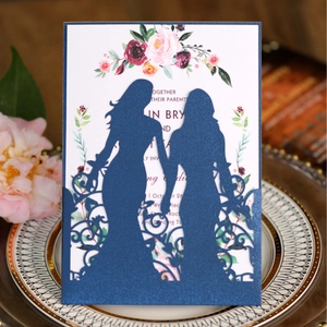 Laser cut navy wedding invitation featuring two female silhouettes and floral inner card
