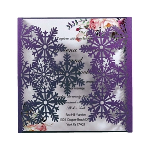 Laser cut white snowflake wedding invitation card with purple sleeve and floral insert