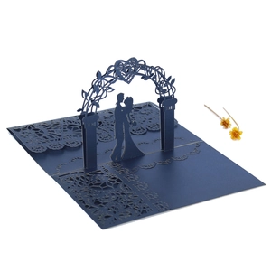 Macro view of navy blue laser-cut 3D wedding invitation showing lace patterns