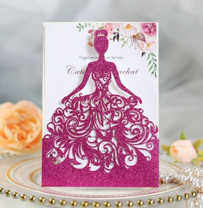 Macro detail of laser-cut rose red glitter wedding invitation with elegant girl silhouette