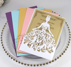 Detailed laser-cut wedding invitation featuring elegant hollow dress design in multiple colors