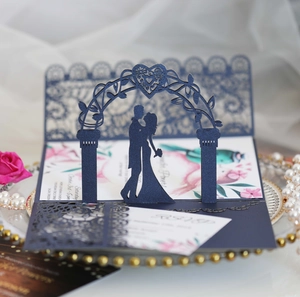 Detail of laser cut navy blue 3D wedding invitation card with RSVP and floral inner leaf
