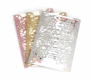 Laser cut glitter wedding invitation set in pink, gold, and silver floral hollow design