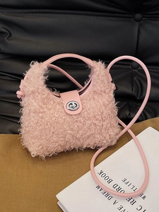 Pink faux shearling crossbody bag with metal twist lock and plush shoulder strap