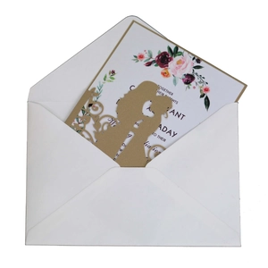 Elegant gold laser-cut wedding invitation set with couple silhouette and floral insert
