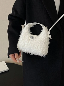 Chic white faux shearling crossbody bag with leather strap and metal twist lock detail