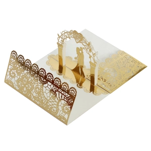 Detailed 3D laser-cut wedding invitation featuring a gold mirrored kissing couple silhouette