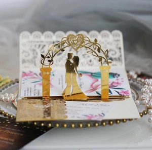 Detailed laser cut lace wedding invitation with 3D gold foil bridal pop-up design