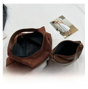 Top view of the interior structure showing the brown tote bag and inner pouch