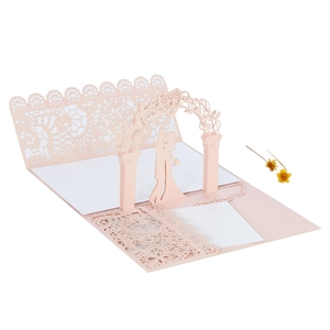 Detail of 3D laser-cut wedding invitation featuring a romantic pink pop-up couple design