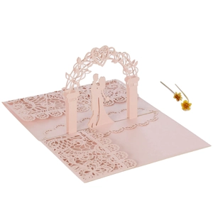 Detailed 3D laser cut wedding invitation showing pink lace patterns and heart arch
