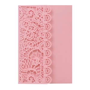 Detailed laser-cut floral pattern on pink wedding invitation made of premium art paper