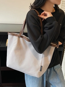 Minimalist canvas tote bag with brown leather trim and large capacity for women