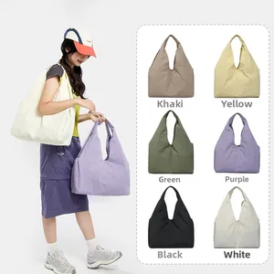 Detail view of large capacity nylon tote bags shown in six different vibrant colors