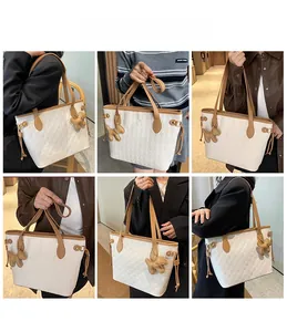 White woven tote bag with brown straps and dog charm shown on various models