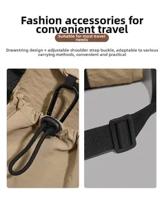 Close-up of khaki nylon travel bag featuring black drawstring closure and adjustable buckle