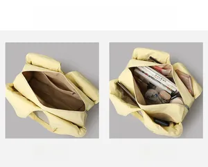 Detail of the multi-compartment interior and spacious storage in a beige tote bag