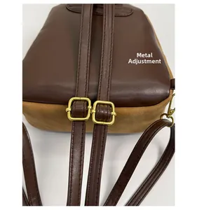 Detail of adjustable golden hardware and leather straps on the leopard backpack