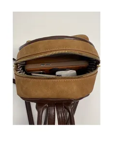 Interior view showing the storage capacity of the brown patchwork mini backpack for essentials