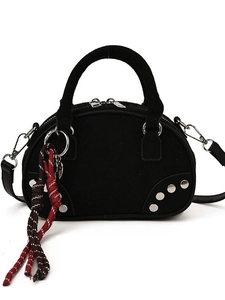 Black suede crossbody bag with silver rivets and colorful braided cord charm detail