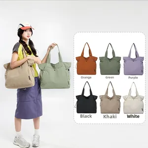 Detail of large nylon tote bag showing six colors and drawstring closure design