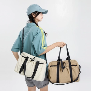 Detail view of large nylon travel tote bags with drawstring closure and durable straps