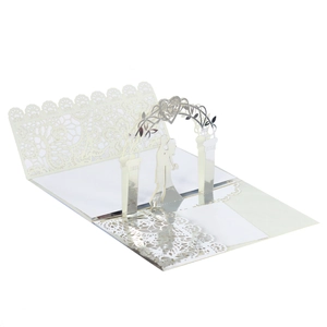 3D laser cut wedding card detail with white lace edges and silver paper accents