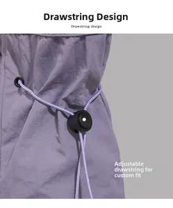 Detail view of the drawstring design and black spring toggle on a lavender tote bag