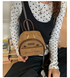 Lifestyle shot showing a mini leopard cat backpack worn by a model in a cozy setting