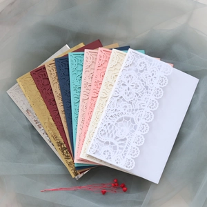 Detailed laser-cut lace wedding invitations showing various elegant colors and patterns