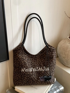 Fashionable leopard print tote bag with black leather straps and embroidered logo for women