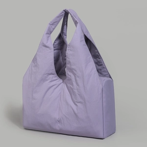 Detail of lavender tote bag featuring a pleated texture and lightweight nylon fabric