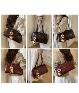 Detail showing vintage shoulder bags in brown and burgundy with cute bear charms