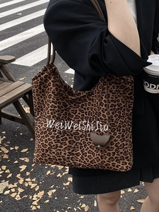 Fashionable leopard print tote bag with embroidery, styled for street leisure wear