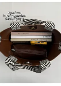 Interior view of brown suede bucket bag with spacious storage for books and a phone