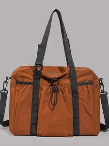 Caramel nylon travel tote bag with drawstring pocket and adjustable shoulder strap