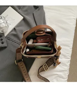 Interior view of vintage bucket bag showing spacious storage for phone and accessories