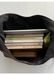 Interior view of large capacity dark brown canvas tote bag showing spacious storage space
