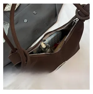 Detail view of the large capacity dark brown hobo bag showing spacious interior with zipper