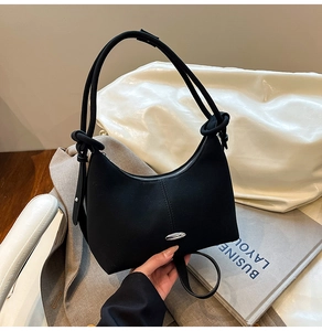 Chic black hobo moon bag with silver oval metal buckle and adjustable shoulder strap