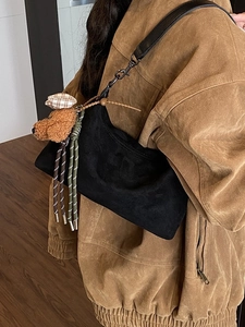 Minimalist black hobo shoulder bag with cute teddy bear charm and braided rope detail