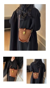 Detail of leopard print bucket bag featuring a gold twist lock and smooth leather trim
