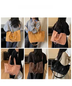 Detailed model showcase of a large textured leather tote bag with multiple carrying styles