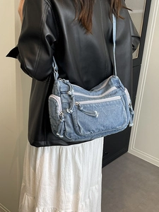Stylish blue denim crossbody bag with multi-pocket design for daily casual commute wear