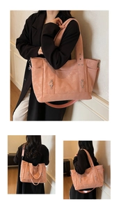 Pink multi-pocket tote bag with wide straps and metal buckles shown in detail