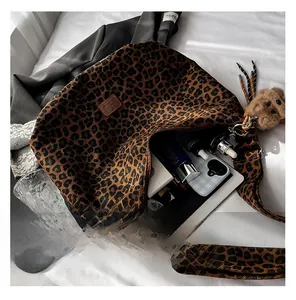 Interior view of leopard print canvas bag showing large capacity for tablet and cosmetics