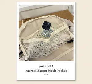 Detail view of internal mesh zipper pocket and quilted texture of the beige backpack